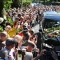 Thousands of Bonnie Tyler fans line the streets as coffin taken to Swansea home